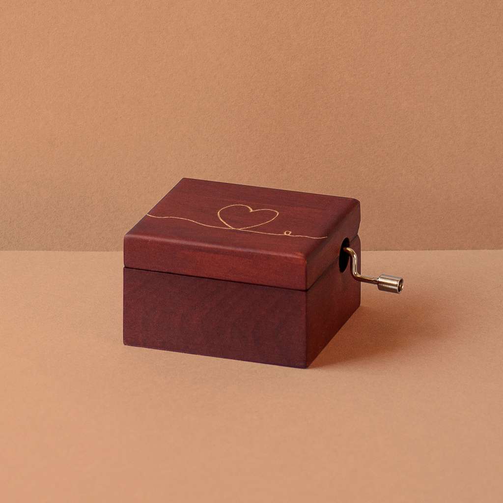 Lacquered wood music box with a heart and the thread of fate