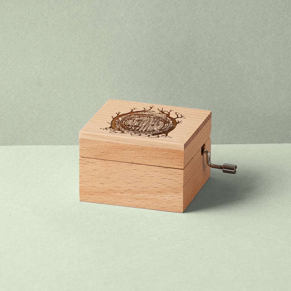 Music box with the Hobbits house engraved on it