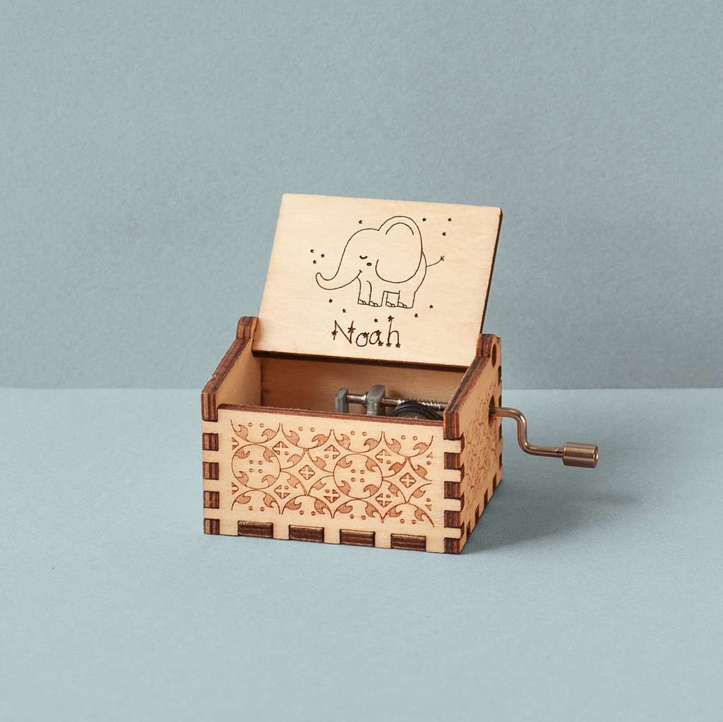 Engraved music box with a baby elephant
